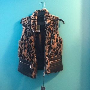 Leopard fur open shoulder vest.